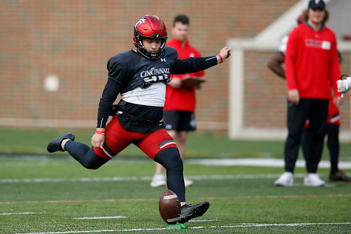 Cincinnati Bearcats kicker Ryan Coe (40) kicks off in a drill during a spring practice at Nippert Stadium in Cincinnati on Thursday, March 24, 2022. Cincinnati Bearcats Spring Practice
